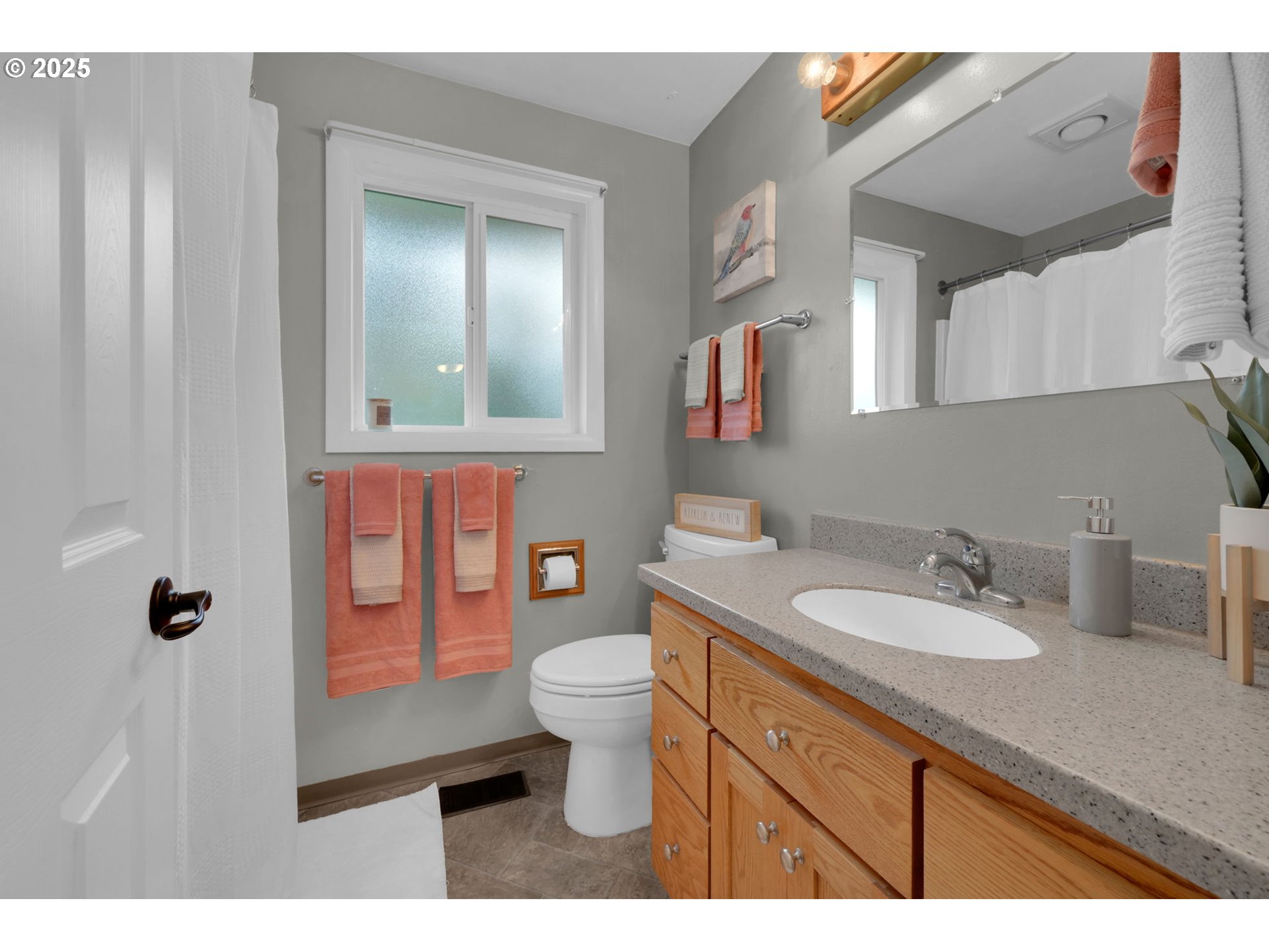 240 Dibblee Lane Eugene, OR 97404 - Photo 29 of 42 a bathroom with a granite countertop sink mirror vanity and toilet