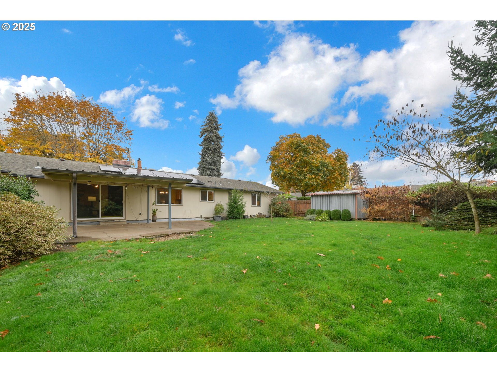 240 Dibblee Lane Eugene, OR 97404 - Photo 35 of 42 a view of a house with a big yard and a fountain