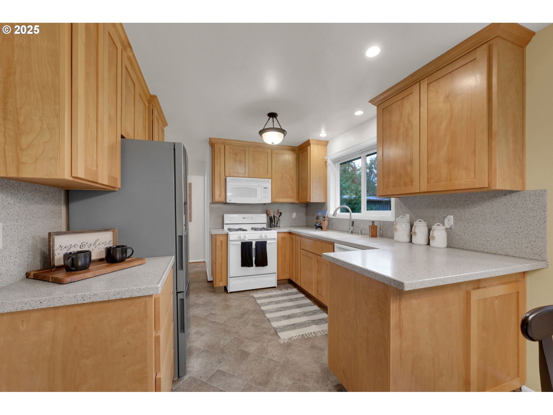 240 Dibblee Lane Eugene, OR 97404 - Photo 9 of 42 a kitchen with cabinets and window