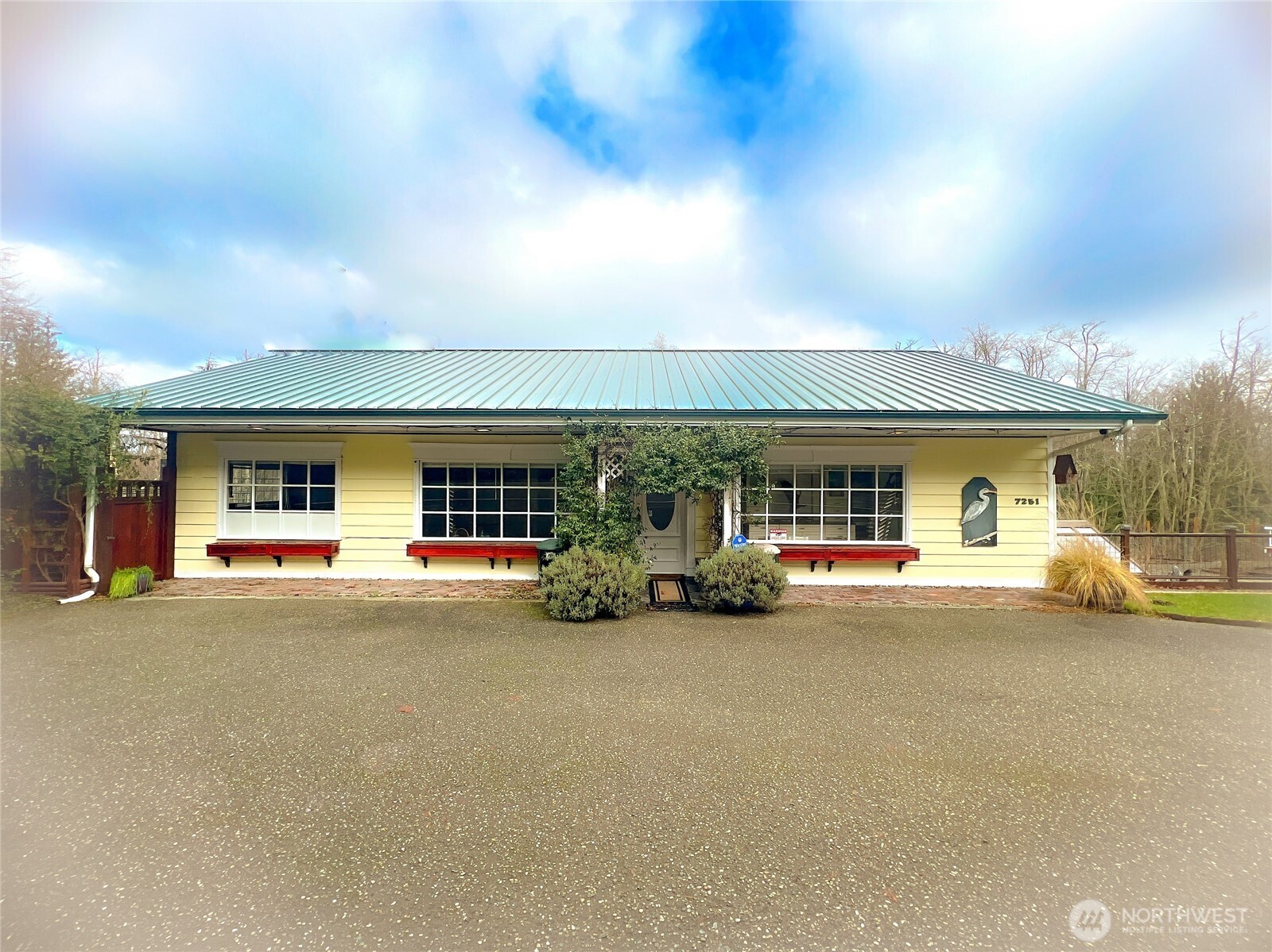 a view of a house with swimming pool and sitting area