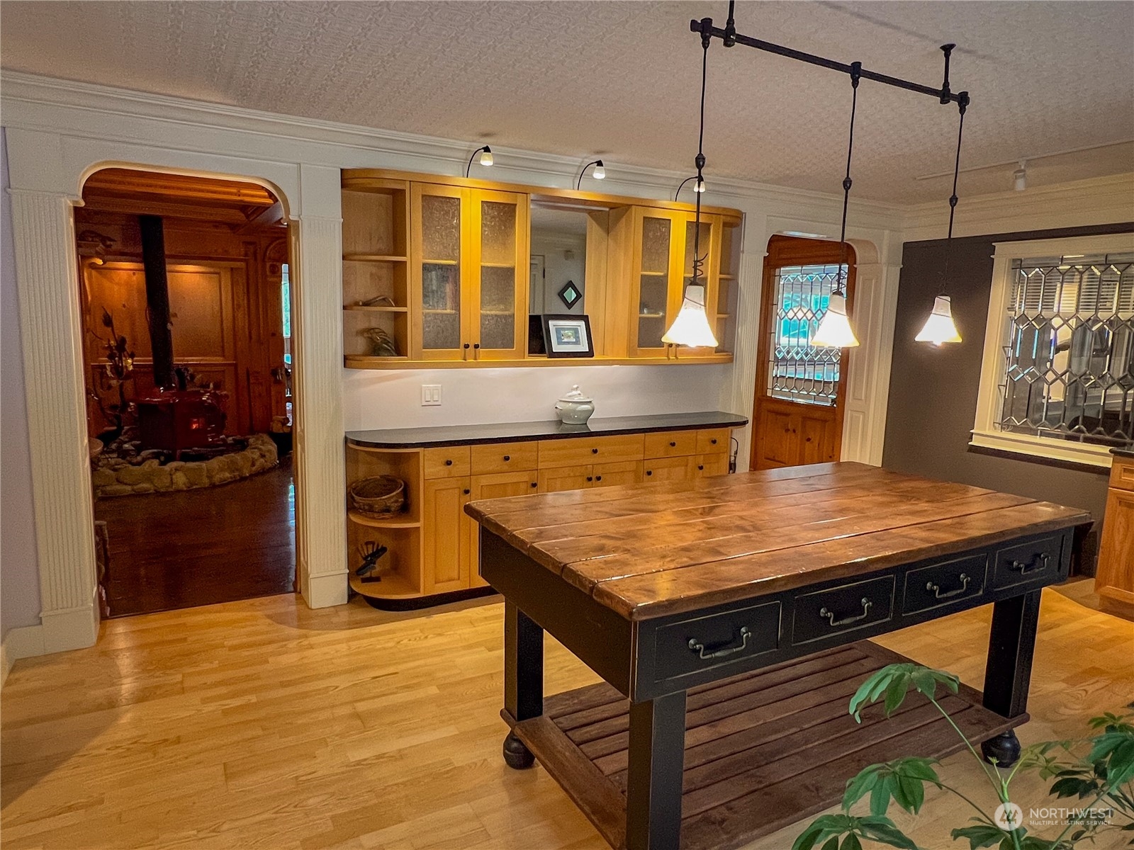 7251 Oak Bay Road Port Ludlow, WA 98365 - Photo 16 of 40 a room with stainless steel appliances wooden floor and large windows