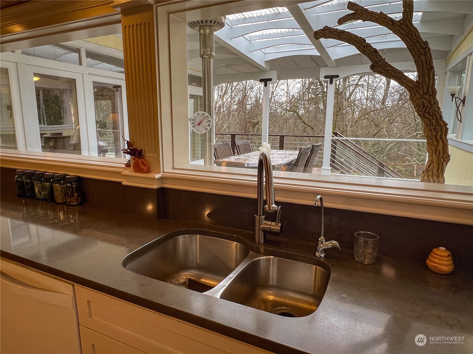 7251 Oak Bay Road Port Ludlow, WA 98365 - Photo 25 of 40 a kitchen with a sink and a large window