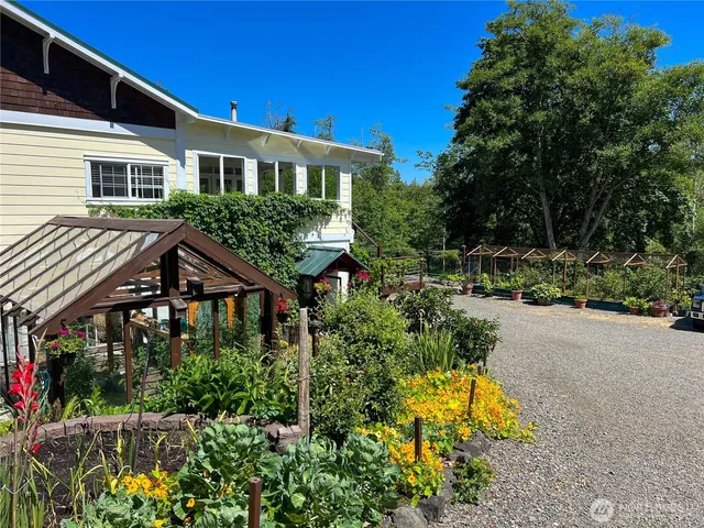 an aerial view of a chairs and table on the roof