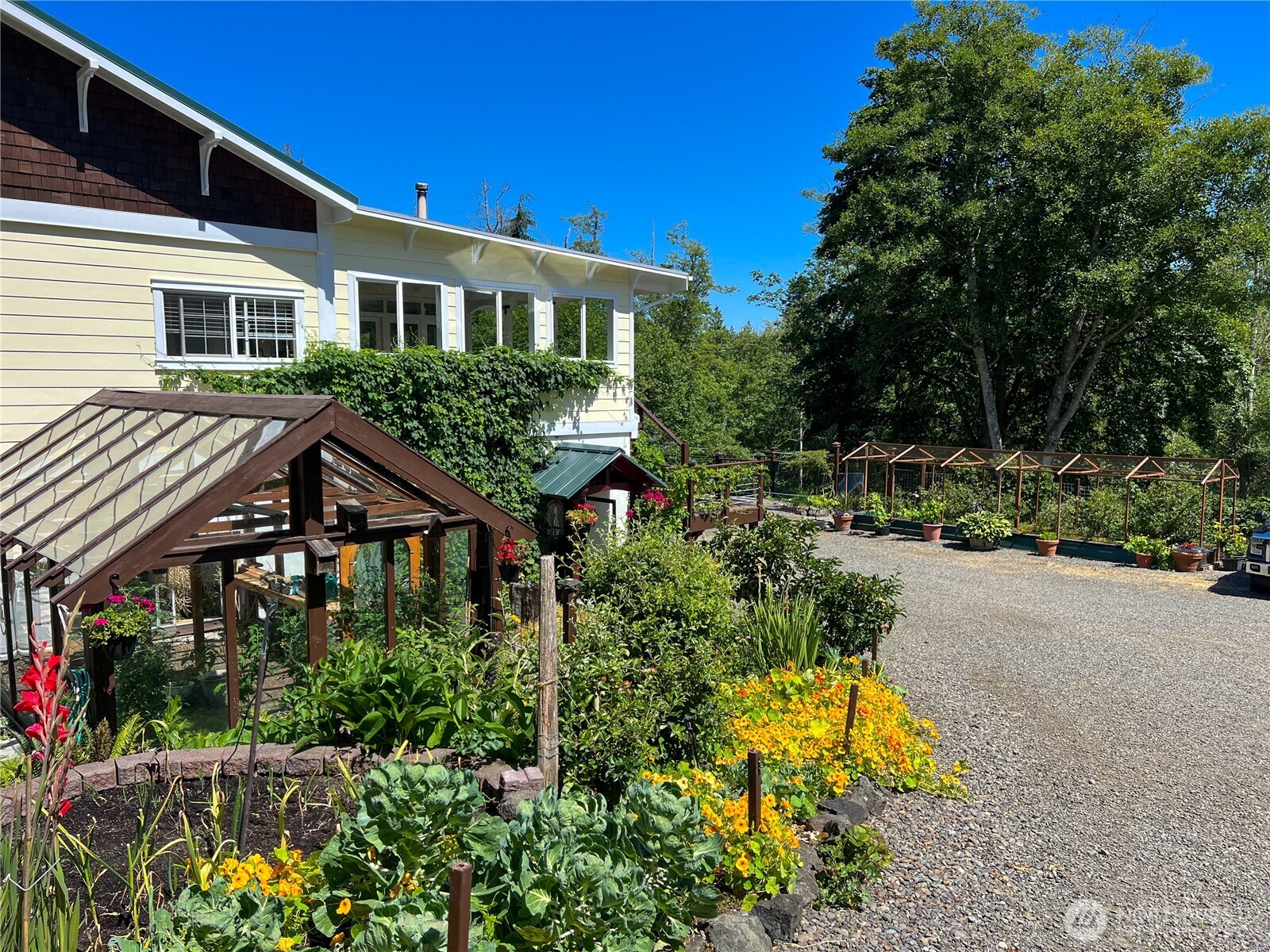 7251 Oak Bay Road Port Ludlow, WA 98365 - Photo 5 of 40 a house view with a garden space