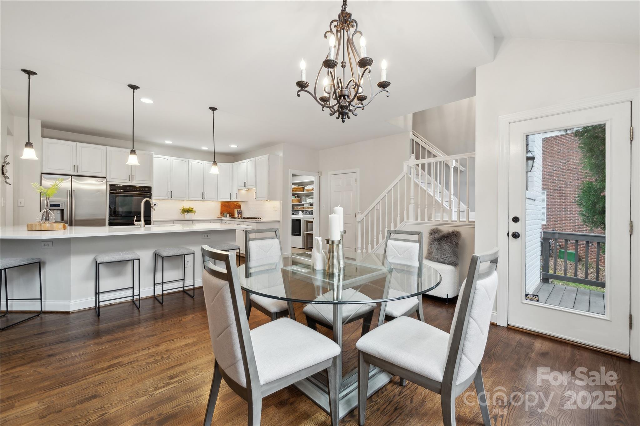 3932 Huckleberry Road Charlotte, NC 28210 - Photo 17 of 45 a view of a dining room with furniture and wooden floor