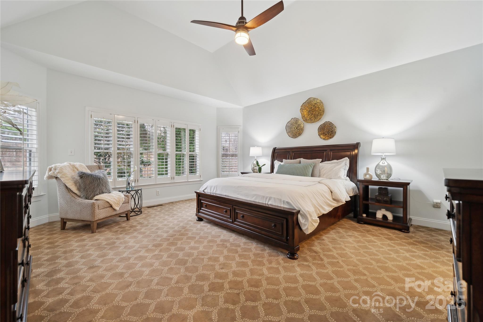 3932 Huckleberry Road Charlotte, NC 28210 - Photo 22 of 45 a spacious bedroom with a bed and a couch