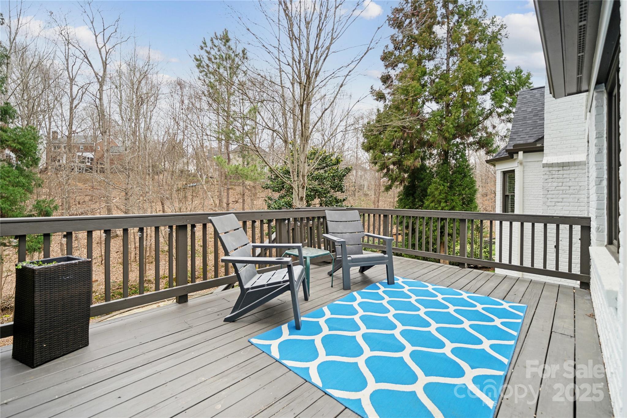 3932 Huckleberry Road Charlotte, NC 28210 - Photo 41 of 45 a balcony with wooden floor table and chairs