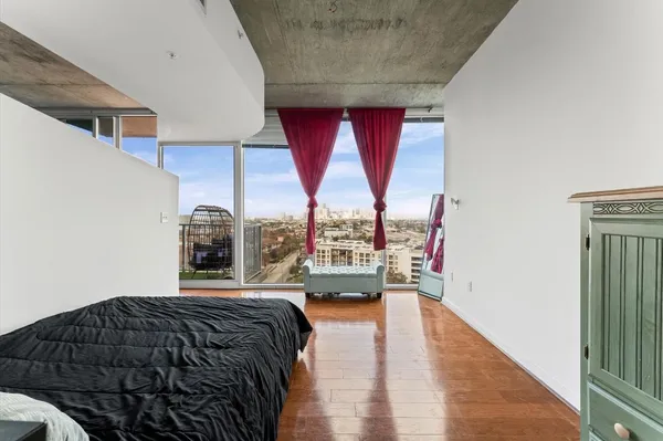 a bedroom with a bed and window