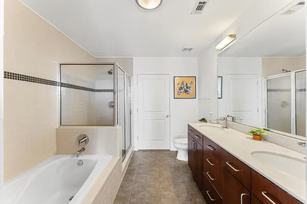 a bathroom with a bathtub and a shower