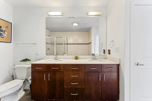 a picture of a bench in front of a wall