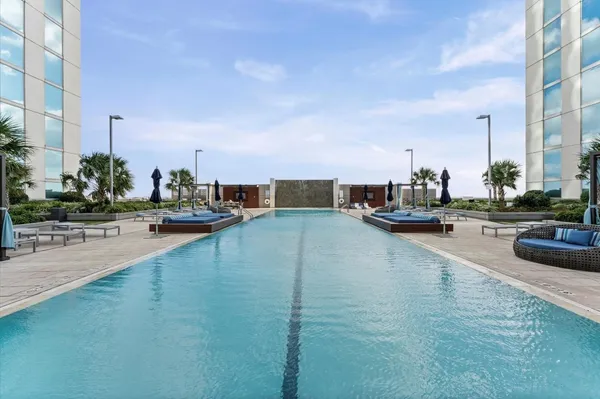 a view of swimming pool from a balcony