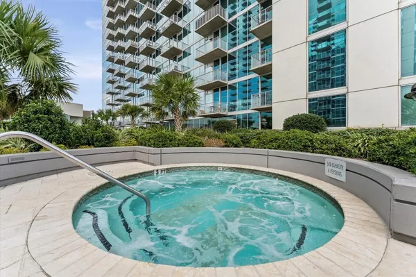 a building with swimming pool in front of it