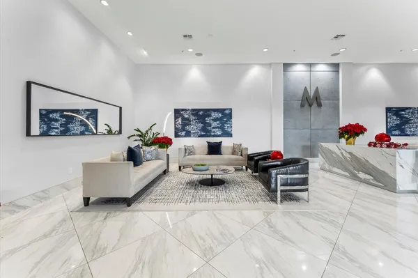 a living room with lots of furniture and a table