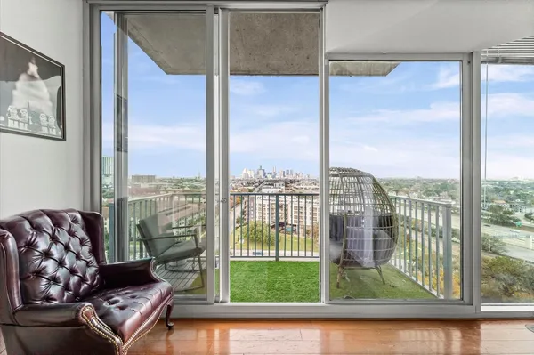 a living room with a large window and floor