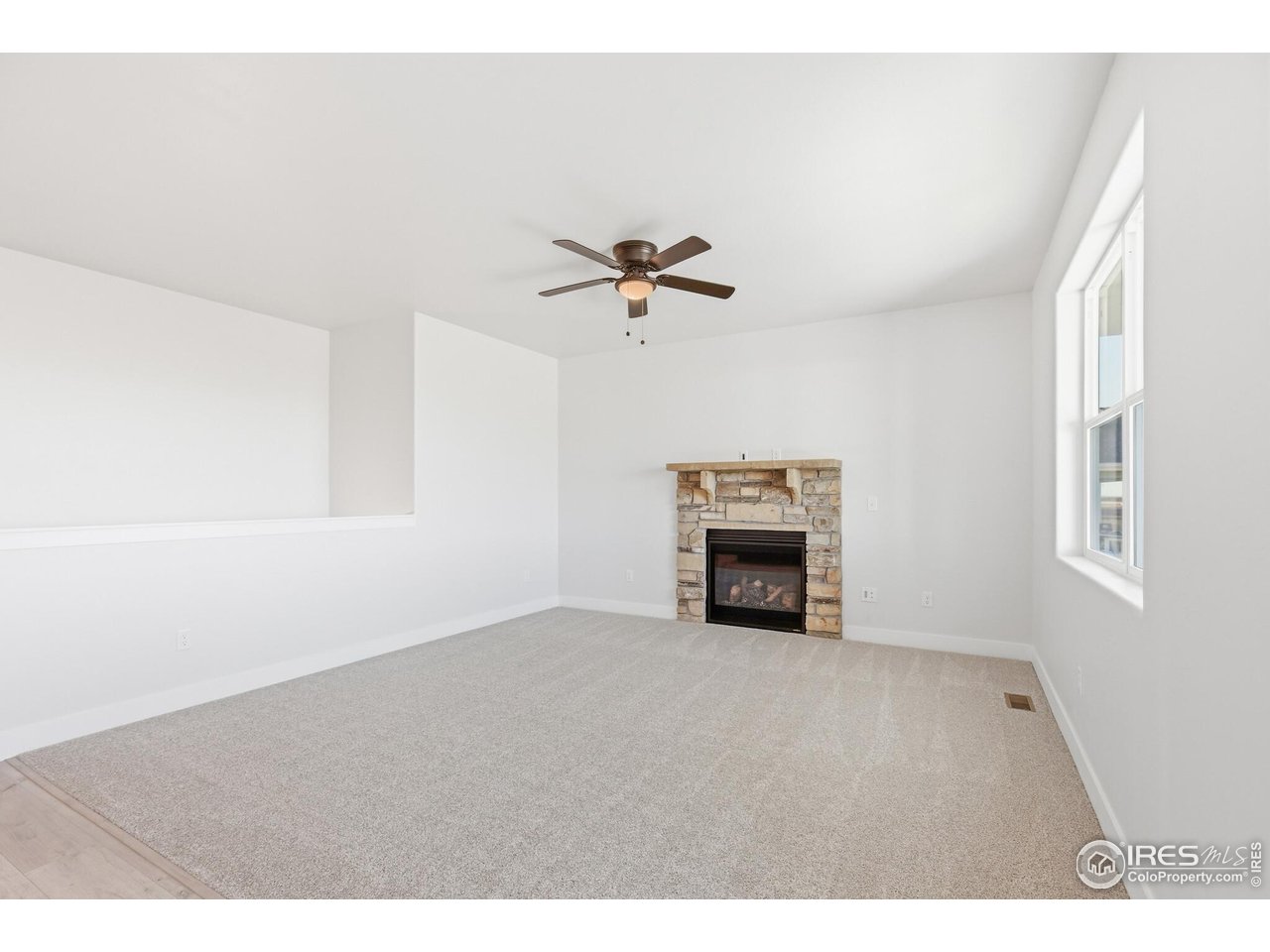 105 7th Avenue Wiggins, CO 80654 - Photo 13 of 18 Natural stone fireplace