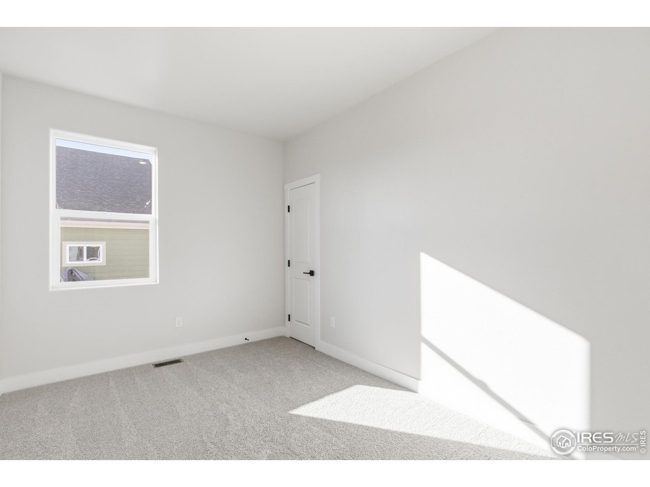 105 7th Avenue Wiggins, CO 80654 - Photo 5 of 18 bedroom 2 with natural light