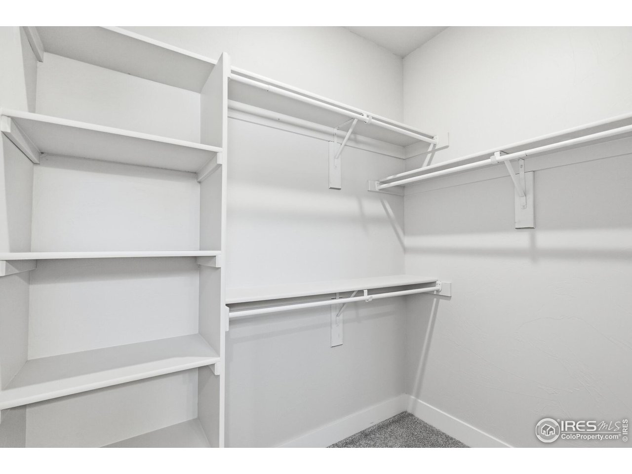 105 7th Avenue Wiggins, CO 80654 - Photo 8 of 18 walk in closet in Primary bedroom