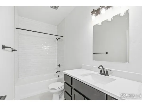 a kitchen with stainless steel appliances a sink stove and refrigerator