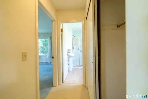 a view of a bathroom from a hallway
