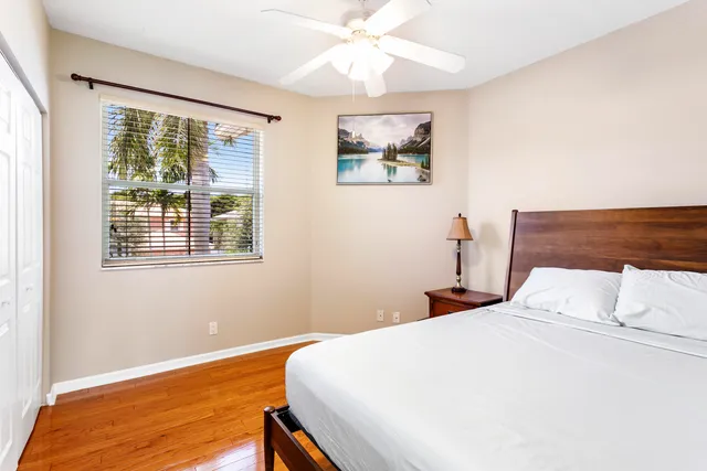 a bedroom with a large bed and a window