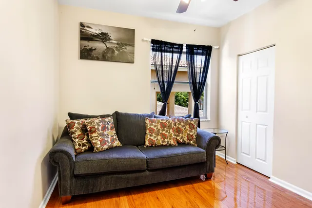 a living room with furniture and a window