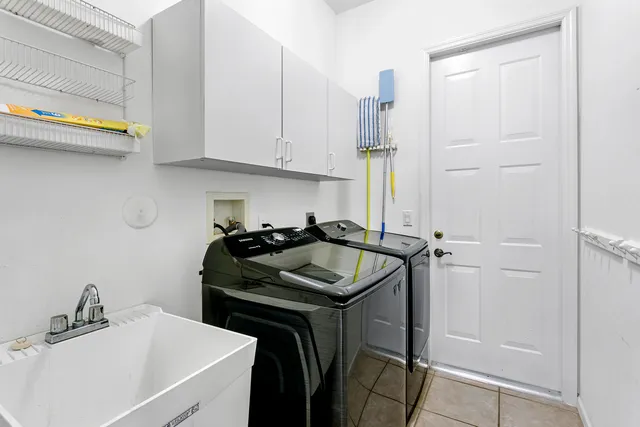 a kitchen with a sink and cabinets
