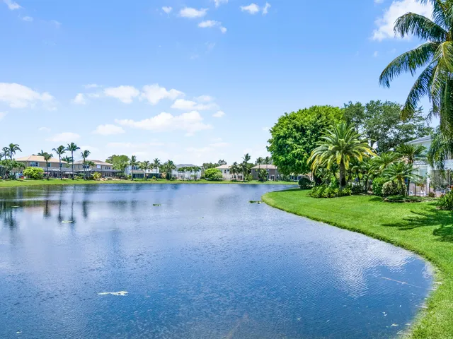 a view of a lake with houses in the back