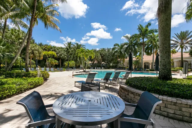 a view of swimming pool with chairs