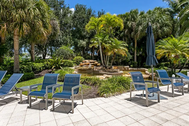 a view of outdoor space with deck and lake view