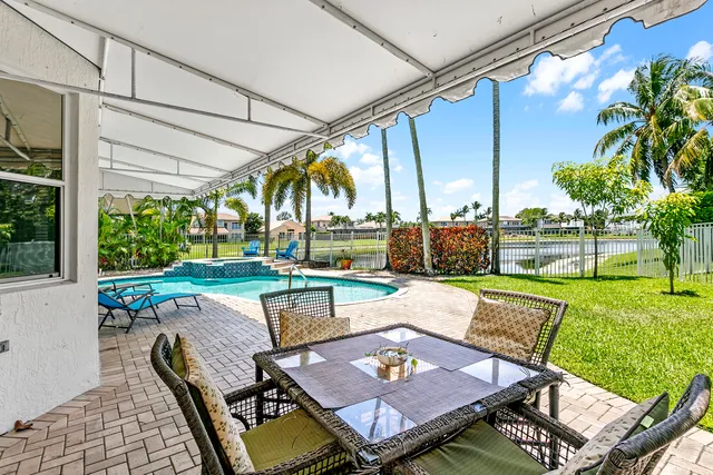 a view of a patio with couches table and chairs