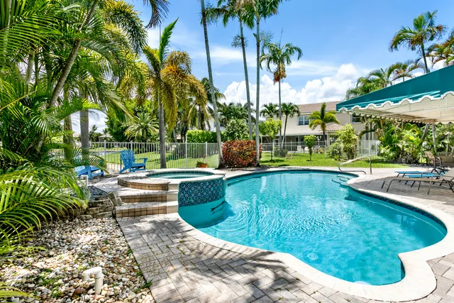 a view of a swimming pool with a patio