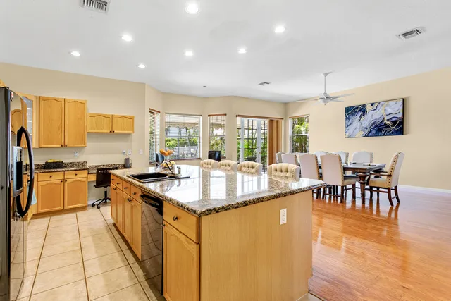 a kitchen with stainless steel appliances granite countertop a sink and stove