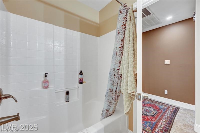 2410 Doherty Way Henderson, NV 89014 - Photo 33 of 63 Bathroom with shower / bath combination with curtain and baseboards