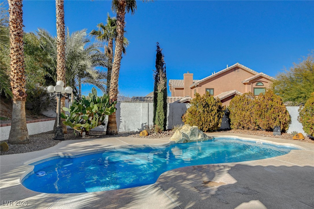 1028 Norellat Road Henderson, NV 89011 - Photo 65 of 74 Sparkling pool with waterfall