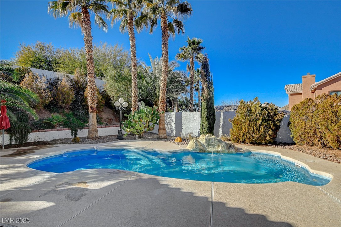 1028 Norellat Road Henderson, NV 89011 - Photo 66 of 74 Sparkling pool with waterfall