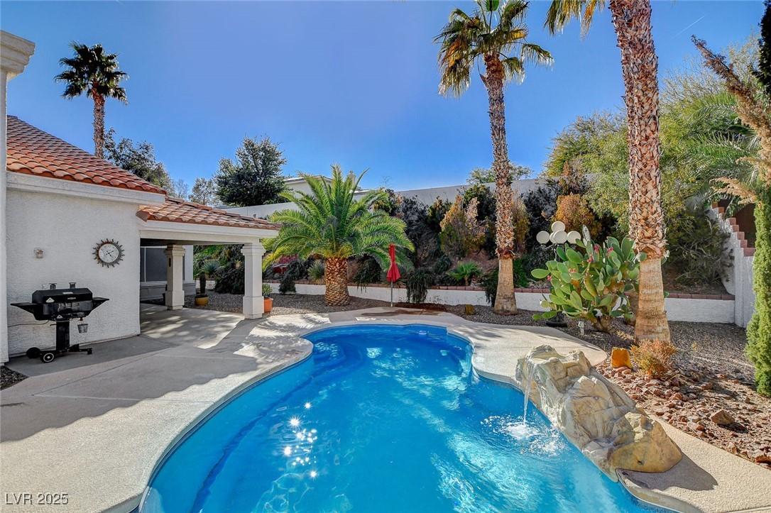 1028 Norellat Road Henderson, NV 89011 - Photo 67 of 74 Sparkling pool with waterfall