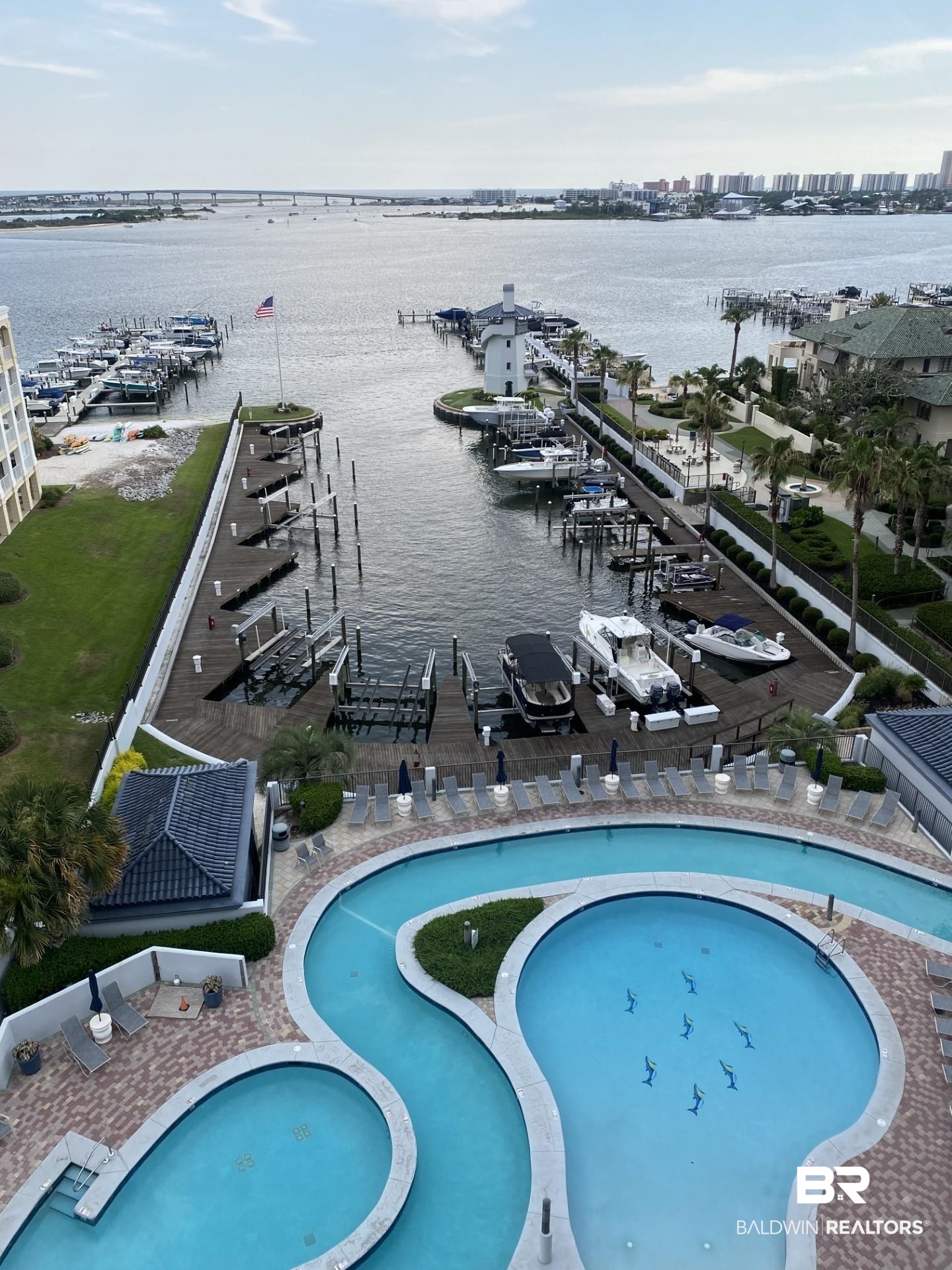 27582 Canal Road, Unit 2813 Orange Beach, AL 36561 - Photo 2 of 2 View of swimming pool featuring a water view, view of marina, and a pool with connected hot tub