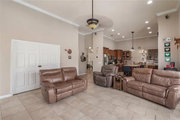 a bedroom with a bed and a ceiling fan