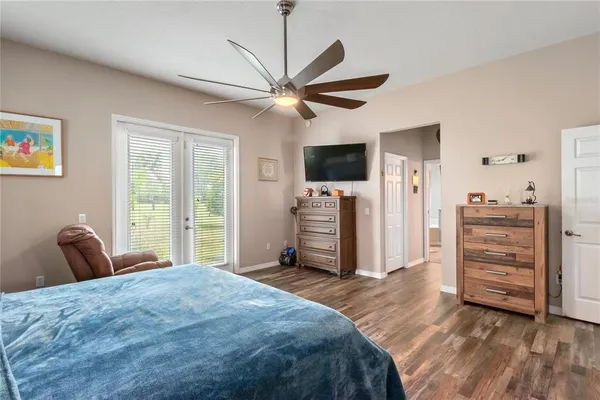 a view of a swimming pool with outdoor seating