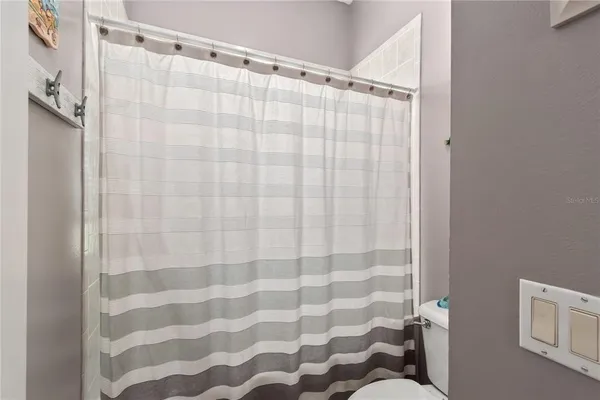 a view of a livingroom with hardwood floor and workspace