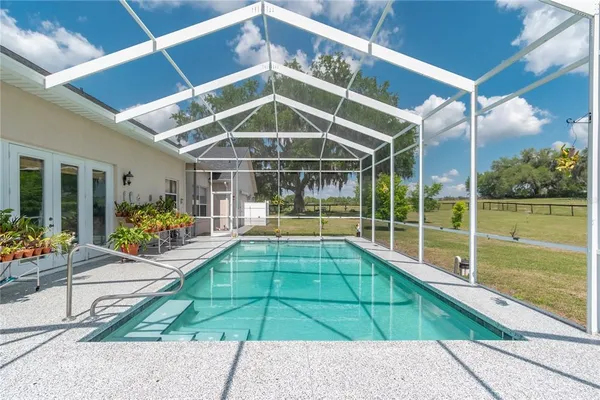 an aerial view of a house with a ocean view
