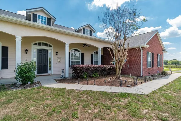 a kitchen with stainless steel appliances a sink stove and refrigerator