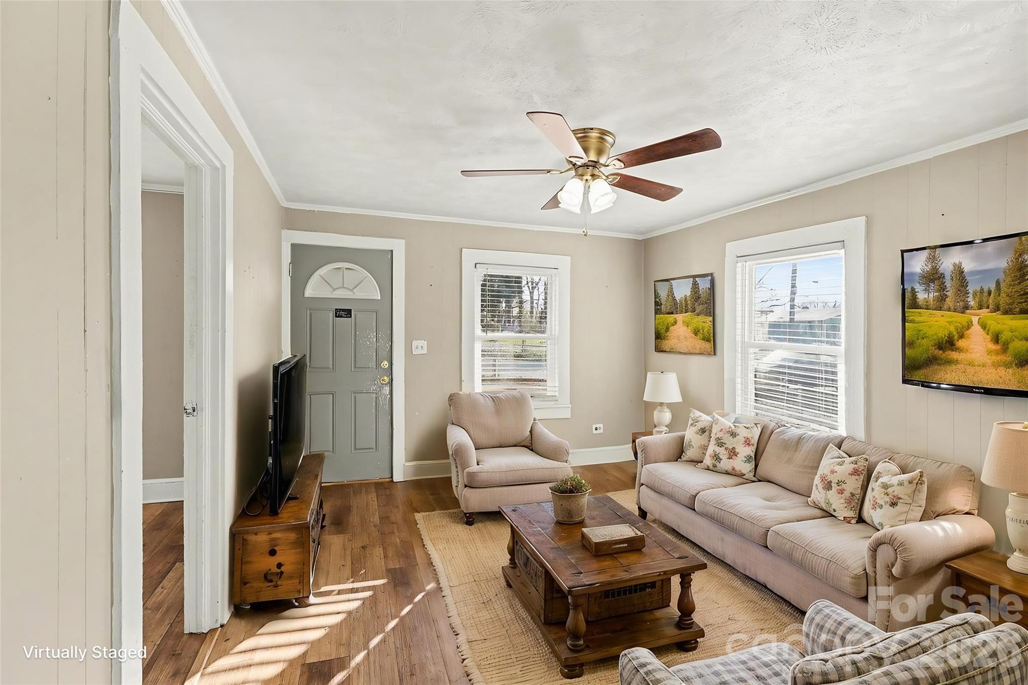 409 South Maple Street Dallas, NC 28034 - Photo 2 of 16 a living room with furniture a ceiling fan and a window