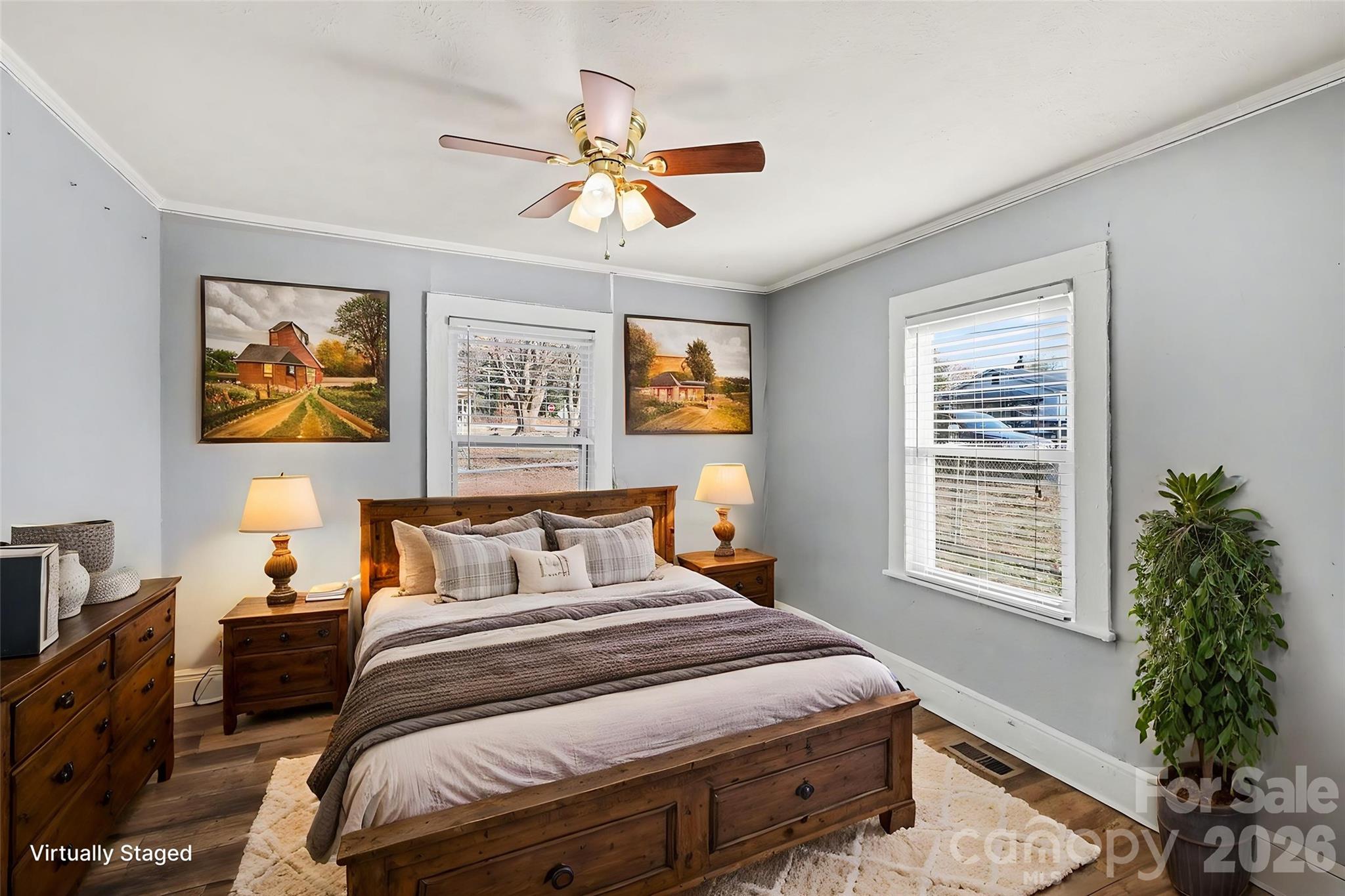 409 South Maple Street Dallas, NC 28034 - Photo 4 of 16 a bedroom with a bed and wooden floor