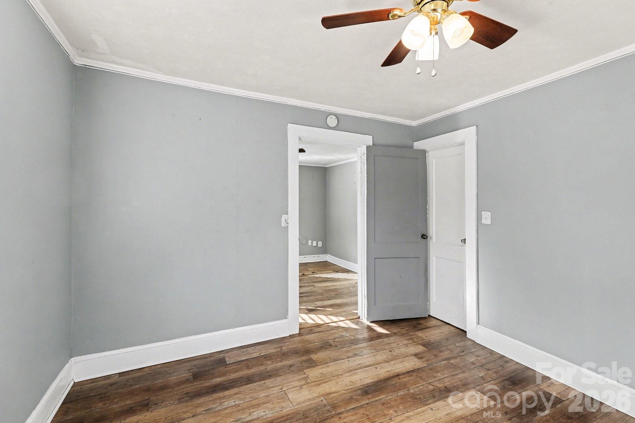 409 South Maple Street Dallas, NC 28034 - Photo 6 of 16 a view of an empty room and wooden floor