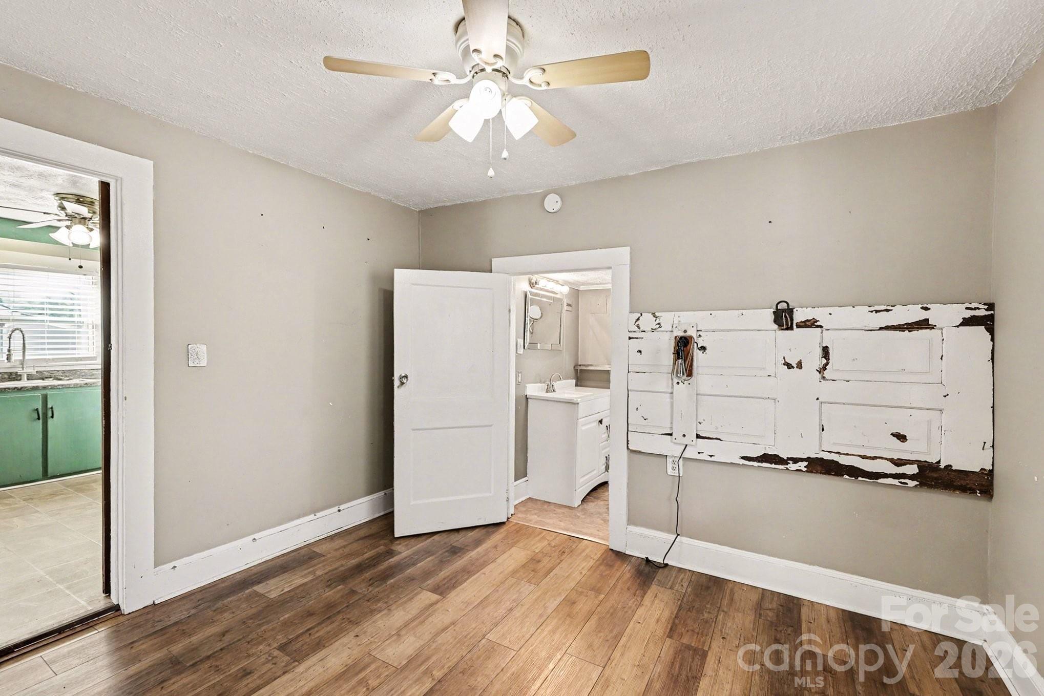 409 South Maple Street Dallas, NC 28034 - Photo 9 of 16 a view of a kitchen with a sink cabinets and wooden floor
