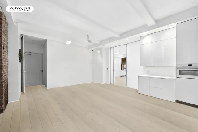a bathroom with a sink mirror and shower