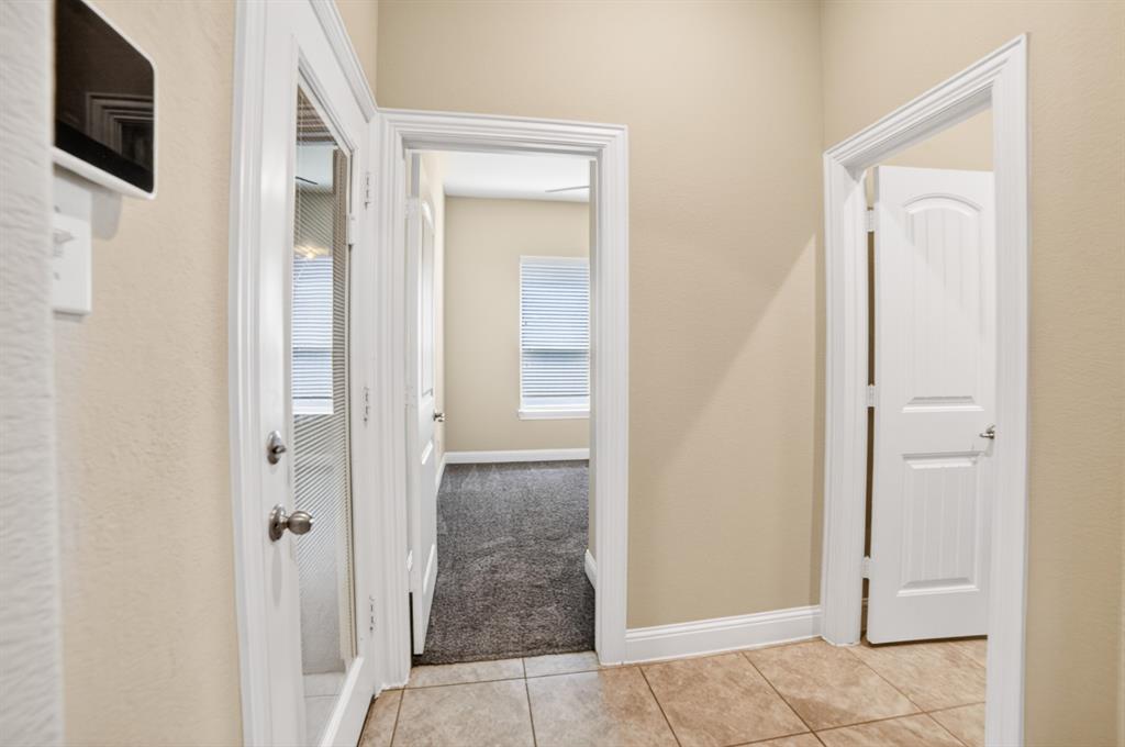 552 Winnetka Drive Oak Point, TX 75068 - Photo 12 of 40 a view of a bathroom from the hallway