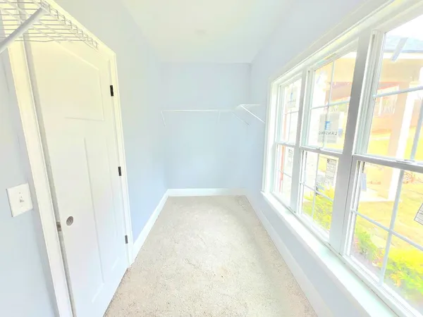 a view of hallway with windows