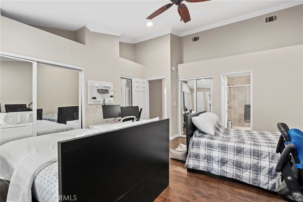 28126 Seco Canyon Road Saugus, CA 91390 - Photo 13 of 30 a bedroom with furniture and a wooden floor